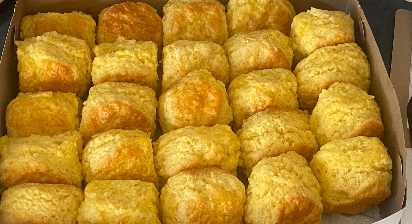 A tray of golden corn muffins, fresh from the oven